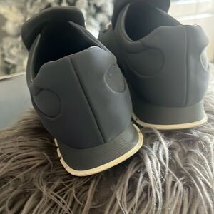 Prada crystal embellished slip on nylon sneakers with leather inside .